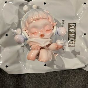 Popmart Skullpanda The Warmth series “chirping” figure.